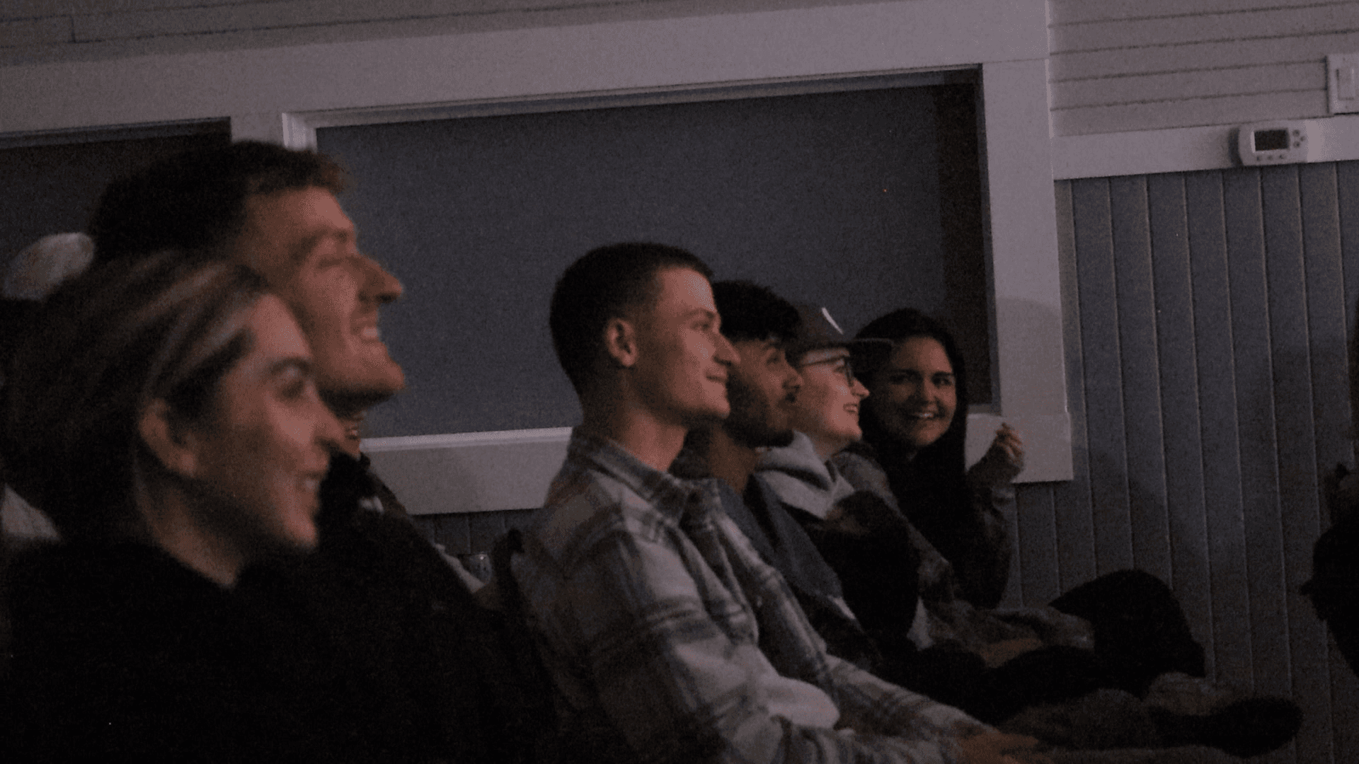 A row of the audience laughing at a Mo Filter Comedy night